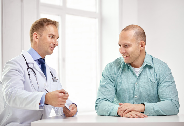 Doctor discussing health concerns with patient in clinic